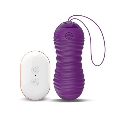 Dispositivo vibratório roxo com comando branco