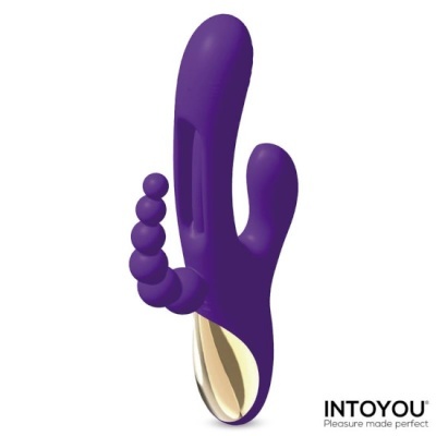 Vibrador roxo com duas pontas e detalhes dourados