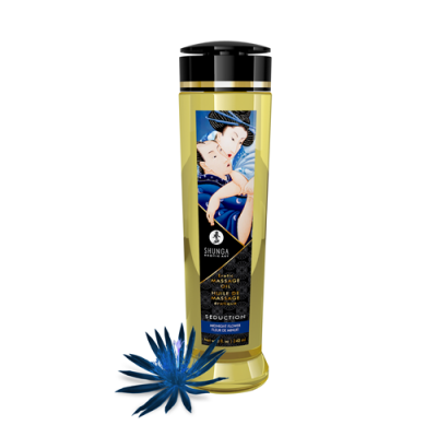 Frasco amarelo de óleo de massagem Shunga com rótulo e flor azul