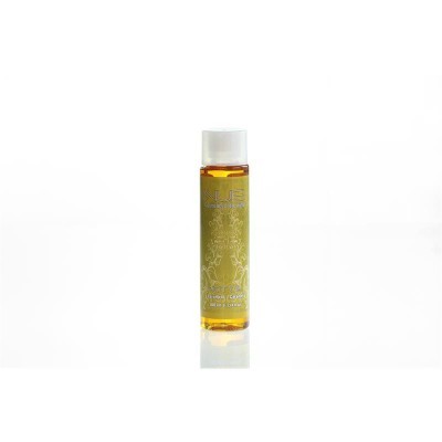 Frasco pequeno de óleo com rótulo dourado e tampa branca