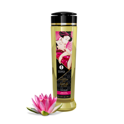 Frasco de óleo de massagem Shunga com rótulo colorido e flor de lótus