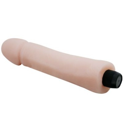 Objeto em forma de pênis de cor bege com tampa preta na base sobre fundo branco
