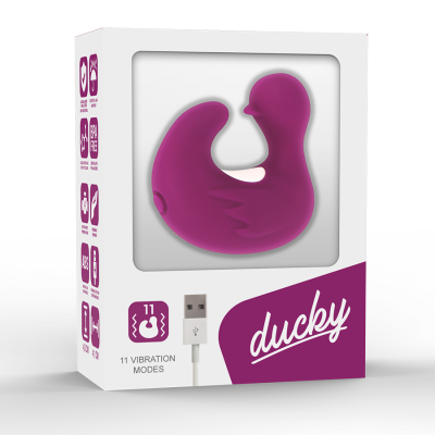 Produto em forma de pato roxo em caixa trasparente com texto '11 VIBRATION MODES' e 'ducky'.