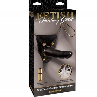 Embalagem de brinquedo erótico vibratório strapon preto com componentes dourados.