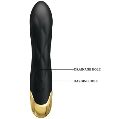 Vibrador preto com base dourada e texto indicando orifícios