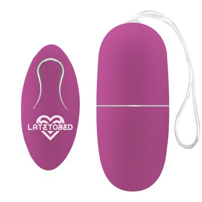 Dispositivo oval roxo com clipe metálico e texto LATETO BED
