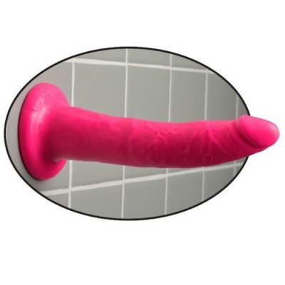 Dildo cor de rosa com ventosa na base fixado numa parede de azulejos