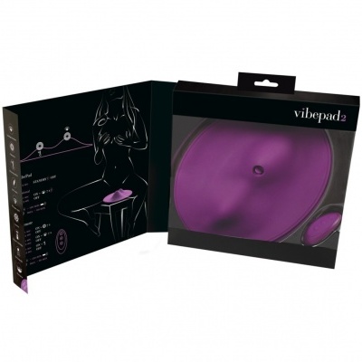 Embalagem aberta do Vibepad 2 roxo com controle remoto em fundo preto
