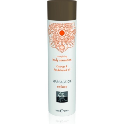 Frasco de óleo de massagem energizante com tampa castanha e rótulo branco com texto laranja e preto.