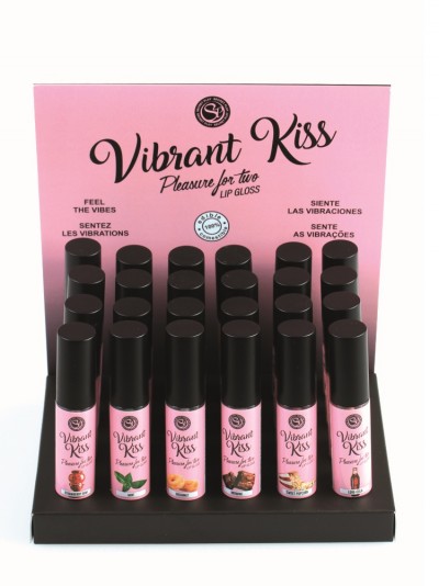 Expositor com 24 unidades de gloss labial Vibrant Kiss, frascos com tampa preta e rótulo rosa, suporte preto e painel rosa com texto multilingue
