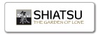 Etiqueta branca com texto 'SHIATSU THE GARDEN OF LOVE' e ícone preto e branco