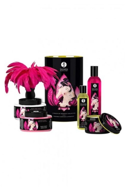 Conjunto de cosméticos Shunga com frascos pretos e rosa e decoração com penas