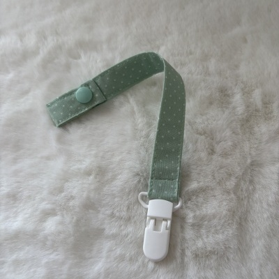 Alça de tecido verde água com bolinhas brancas e clip branco
