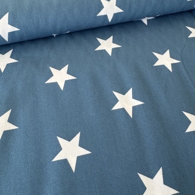 Tecido azul com estrelas brancas desenhadas uniformemente