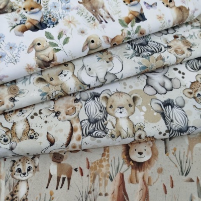 Tecido infantil estampado com vários animais em tons suaves