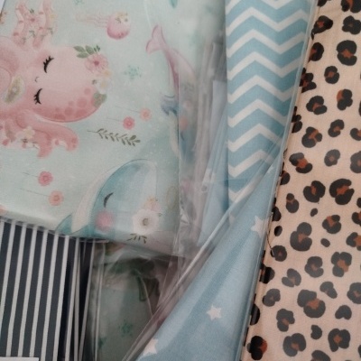 Tecido algodão com padrões de bolinhas, listras, estrelas e desenhos infantis