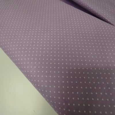 Tecido roxo com pequenos pontos brancos