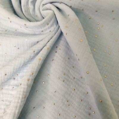 Tecido branco de algodão com pontos dourados