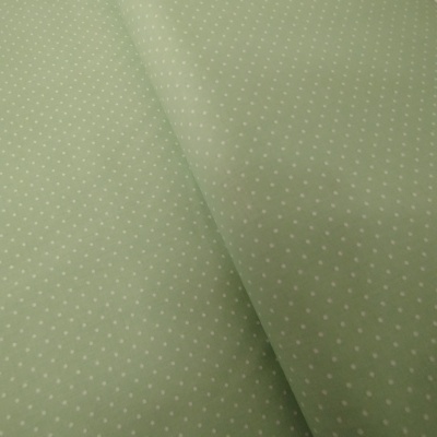 Tecido verde claro com bolinhas brancas