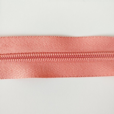 fecho éclair cor-de-rosa sobre fundo branco