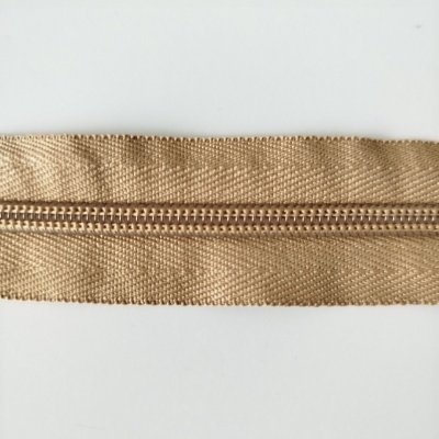 Fecho éclair bege com dentes de plástico