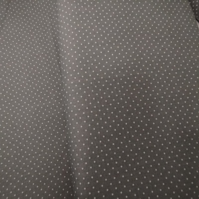 Tecido cinzento com pequenos pontos brancos