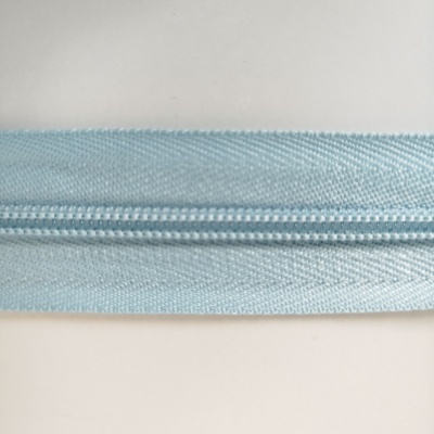 Fecho de correr azul claro em tecido texturado