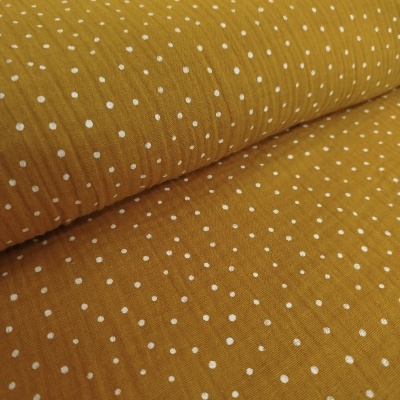 Tecido amarelo mostarda com padrão de pontos brancos