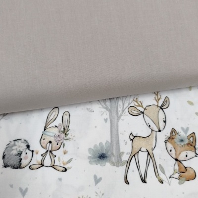 Tecido com padrões de animais infantis em tons suaves e tecido cinza liso