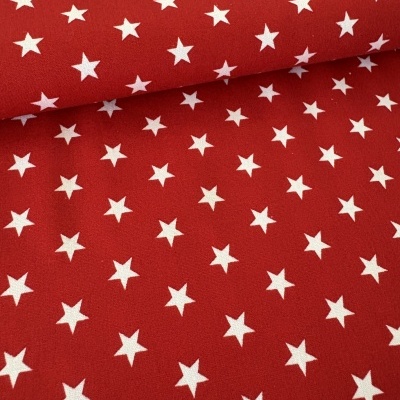 Tecido vermelho com estrelas brancas estampadas
