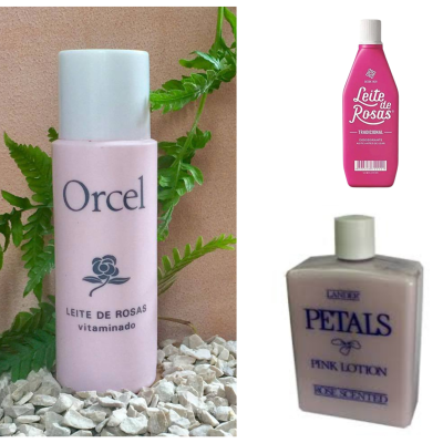Leite de Rosas para minimizar as manchas da pele: Ritual de auto cuidado que ajuda a elevar a autoestima Três frascos de loção corporal em tons de rosa com textos das marcas Orcel, Leite de Rosas e Lanier Petals.
