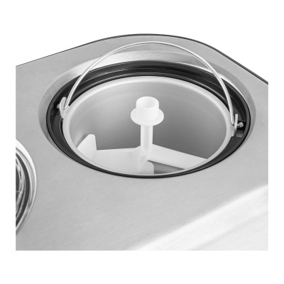 Compartimento circular com tampa transparente e superfície metálica prateada