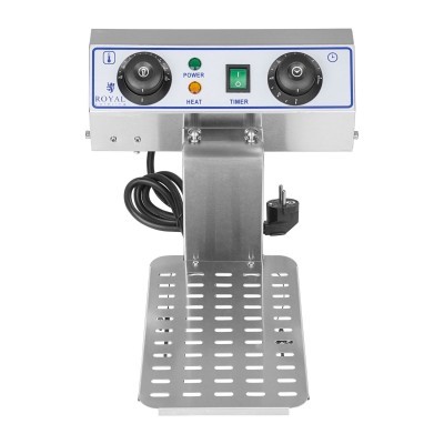 Equipamento metálico prateado com painéis de controlo e base perfurada