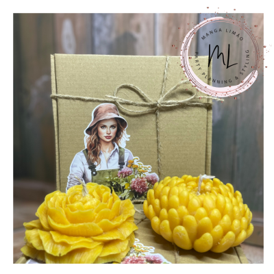 Velas amarelas florais com caixa e recorte de papel com imagem de mulher