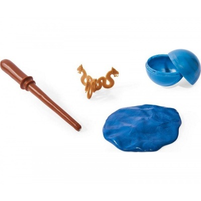 Conjunto com objeto castanho, mola em forma de cobra, massa molde azul e recipiente azul
