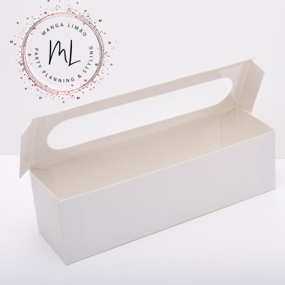 Caixa branca retangular aberta com recorte oval na tampa e logótipo MANGA LIMÃO PARTY PLANNING & STYLING