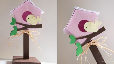 Casa de pássaros decorativa em madeira rosa com elefante e suporte marrom