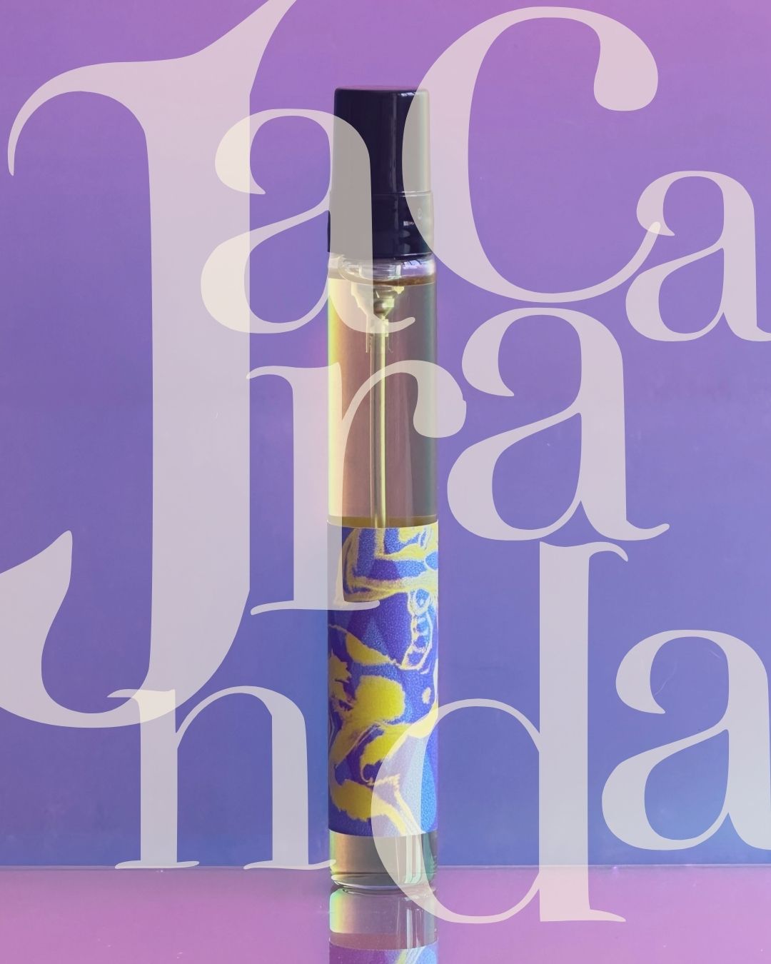 JACARANDA - Lisboa extrait - 7,5 ml TRAVEL SIZE refillable Glass bottle with black cap and blue-yellow label on purple background