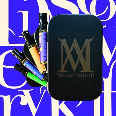 Black box with Manuel Attardi logo and five small spray bottles with colorful labels