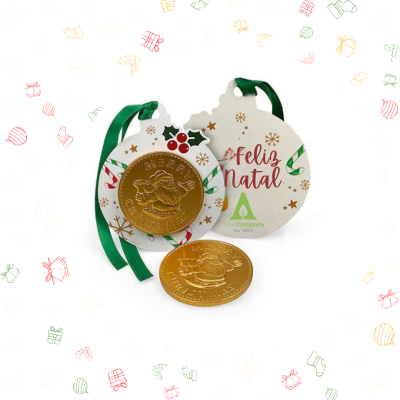 Chocolates em forma de moeda com decoração de Natal e cartão 'Feliz Natal'