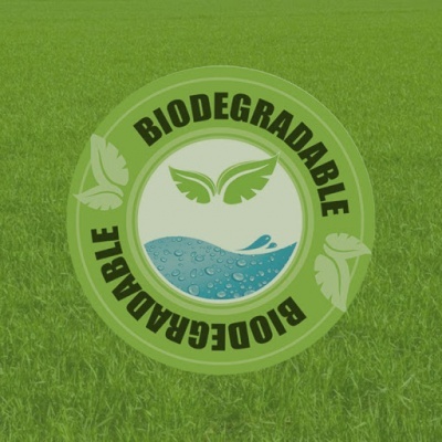Selo biodegradável verde sobre relva