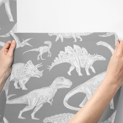 Papel de parede cinzento com padrão de dinossauros branco em relevo