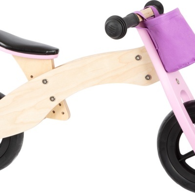Bicicleta de equilíbrio para crianças em madeira com partes rosa e preta.