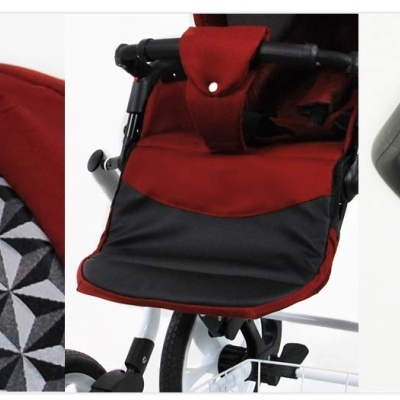 Detalhes de carrinho de bebé vermelho e preto com padrão geométrico e pega preta