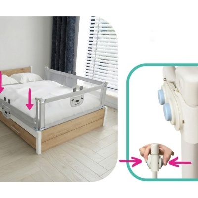 Barreira de cama infantil branca com desenhos de urso numa cama de madeira clara