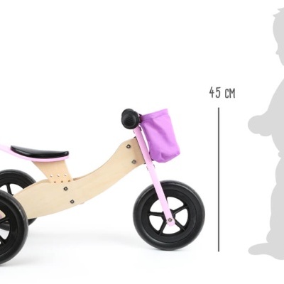 Bicicleta de equilíbrio infantil em madeira com detalhes cor de rosa e rodas negras