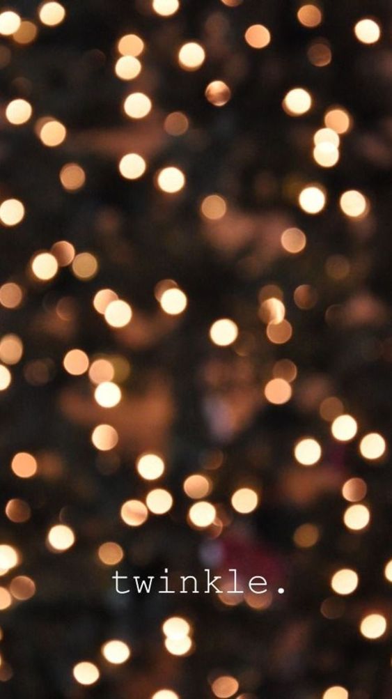 Produto X Luzes decorativas desfocadas com a palavra twinkle.