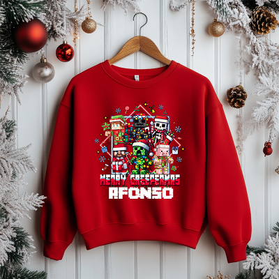 Sweatshirt vermelha com texto e personagens natalícios em estilo pixelado