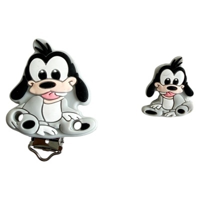 Dois acessórios em silicone com desenho de cão preto e branco sobre fundo branco