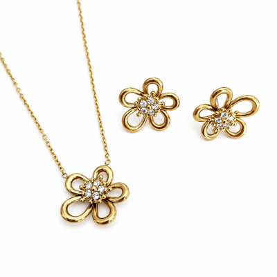 Conjunto de joalharia dourada em forma de flor com cristais.